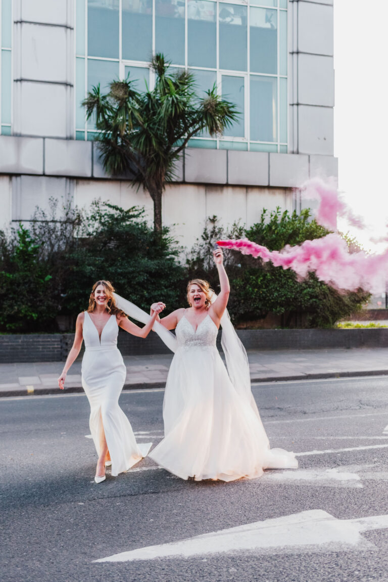 Two brides with smoke cannon in golden hour at loft studios west London