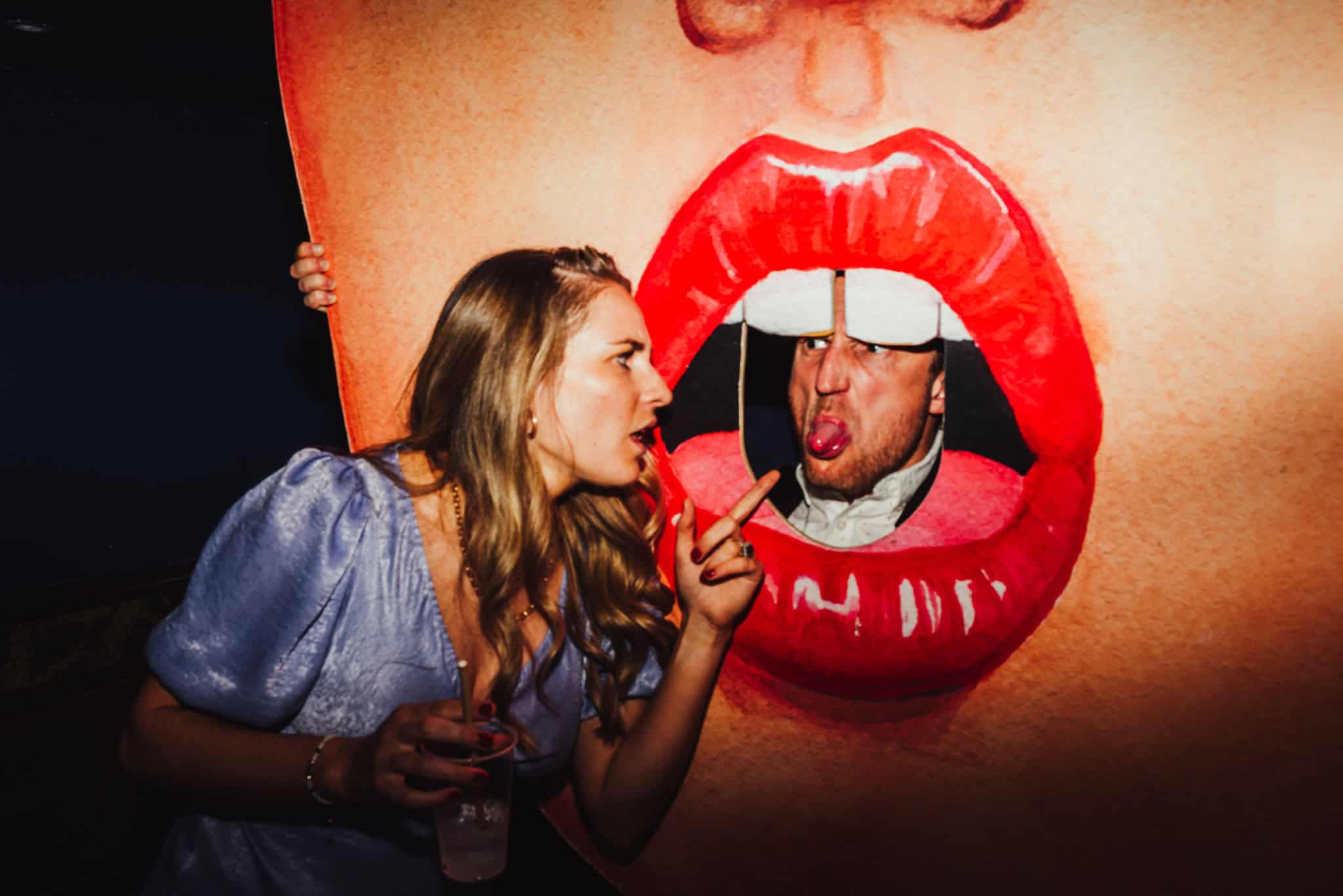 Couple on boat during Porto destination wedding, bride in white dress with flower crown, relaxed summer wedding photography