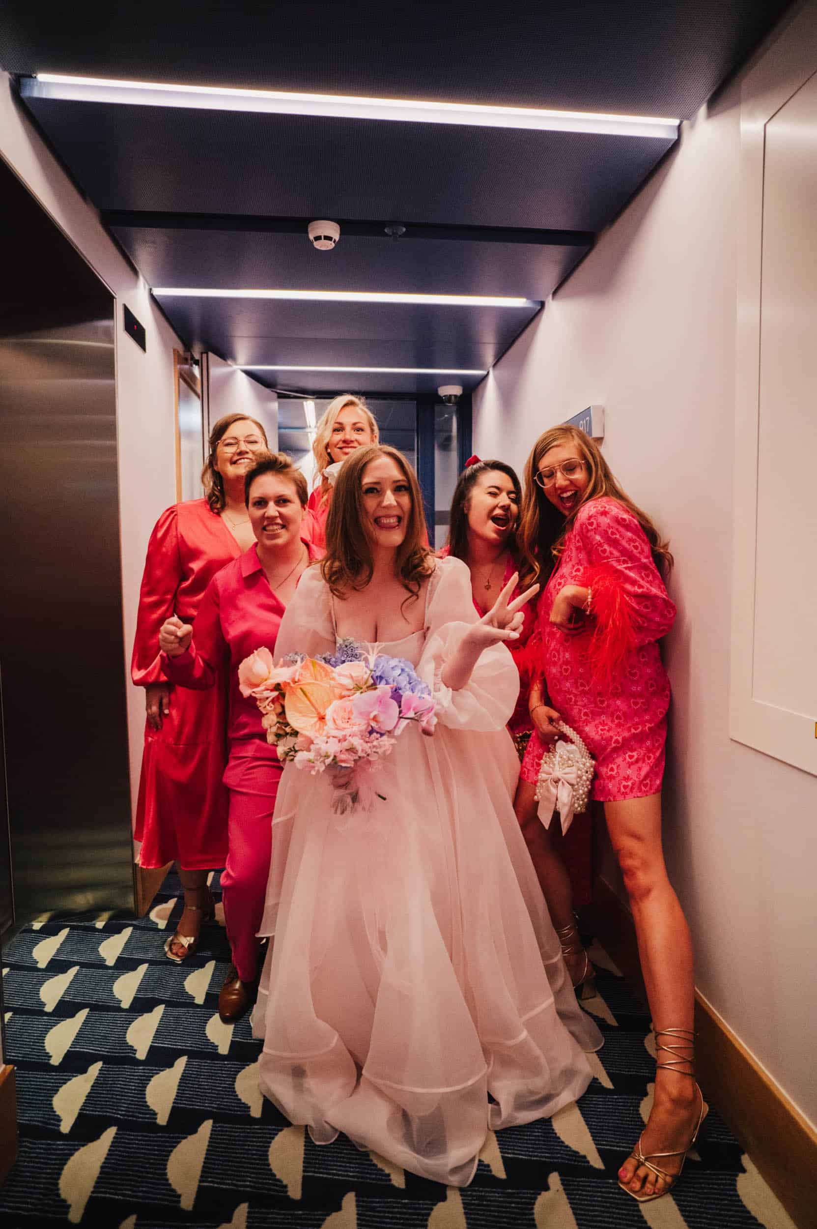 Bride and groom sharing intimate moment by vintage green car on London street, golden hour light, relaxed documentary wedding photography