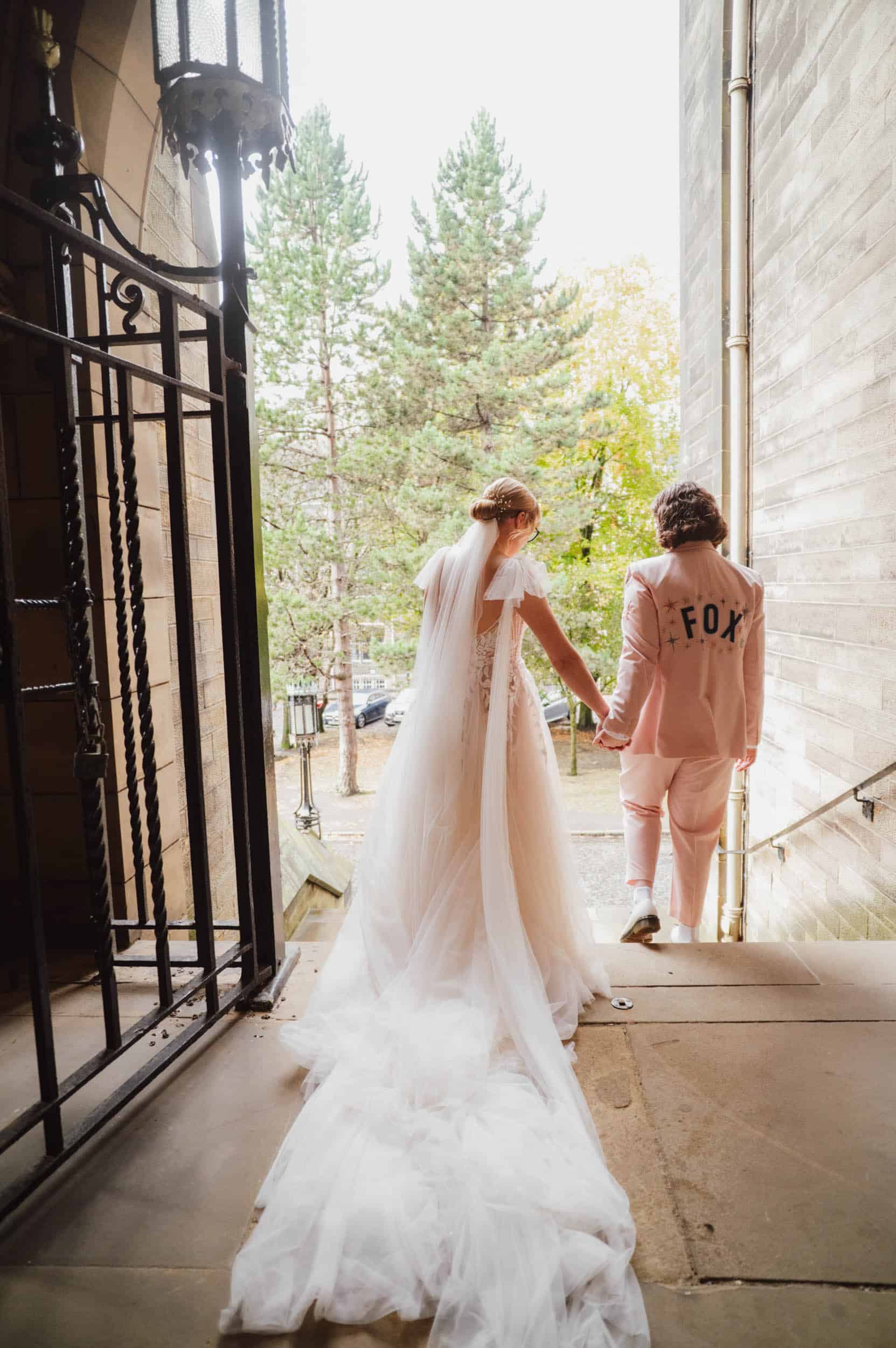 Couple kissing on zebra crossing in golden hour light, Ebury Street London, fun relaxed wedding photography