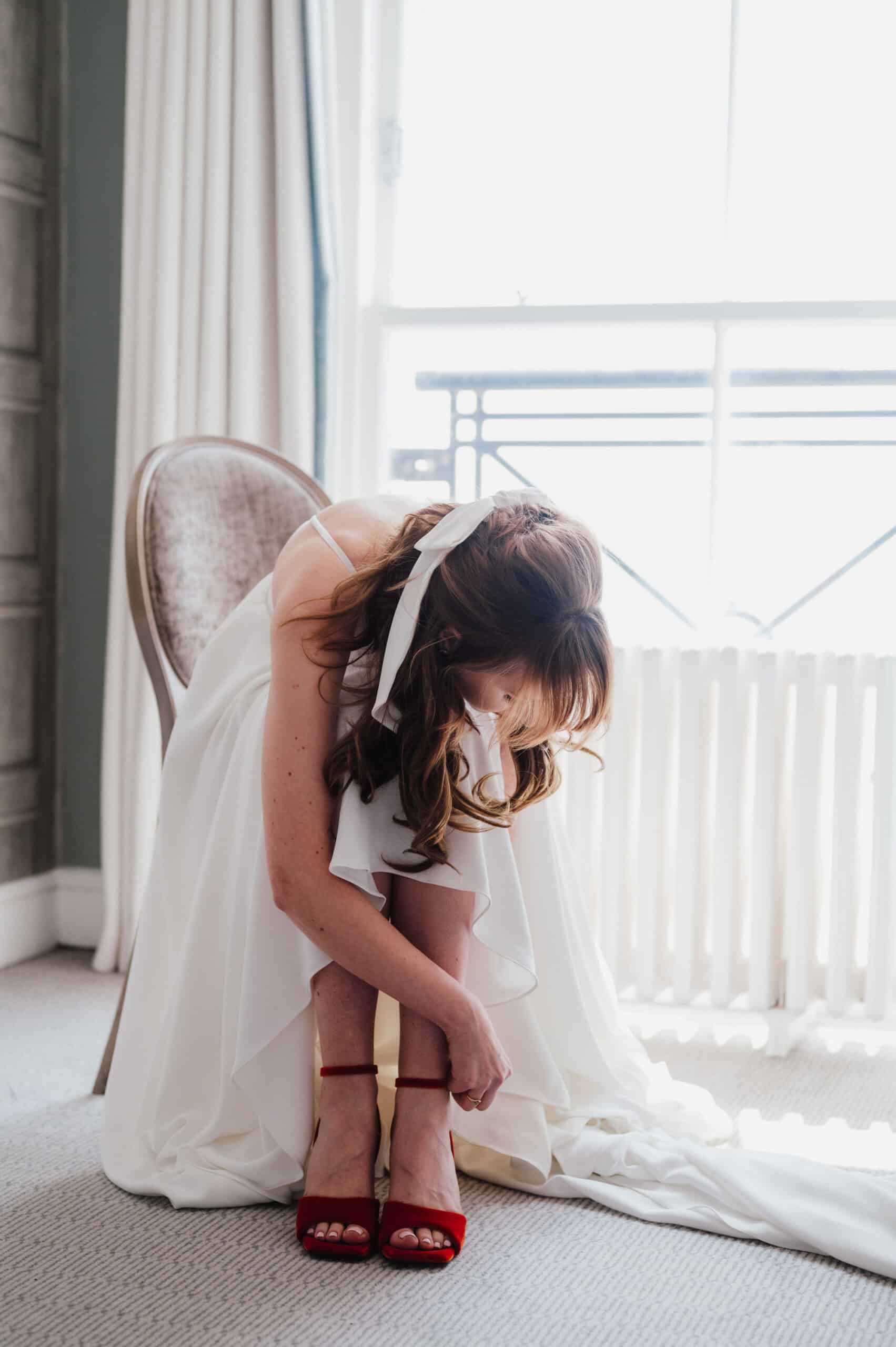 Couple exchanging rings during Brighton Town Hall wedding ceremony, candid documentary wedding photography